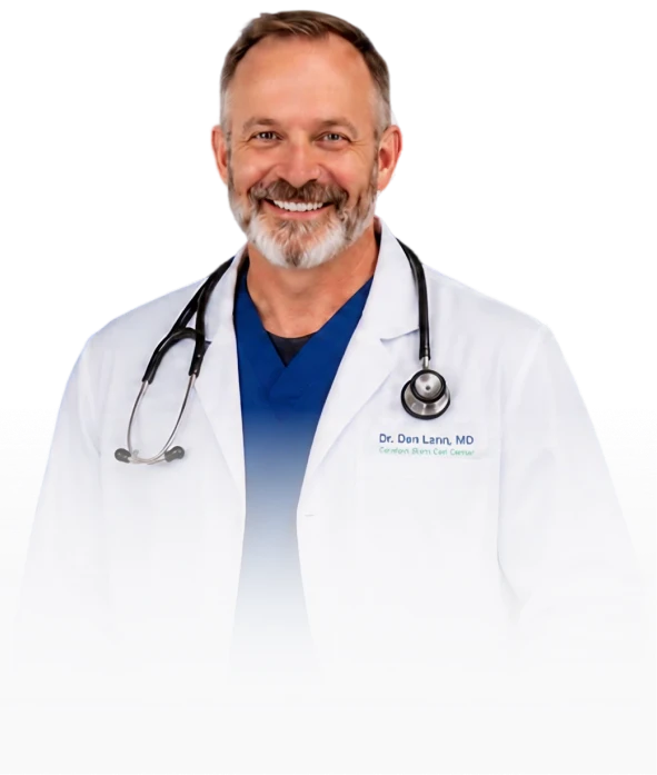 Healthcare visual showing smiling gray-bearded physician in a white coat and blue scrubs with a stethoscope